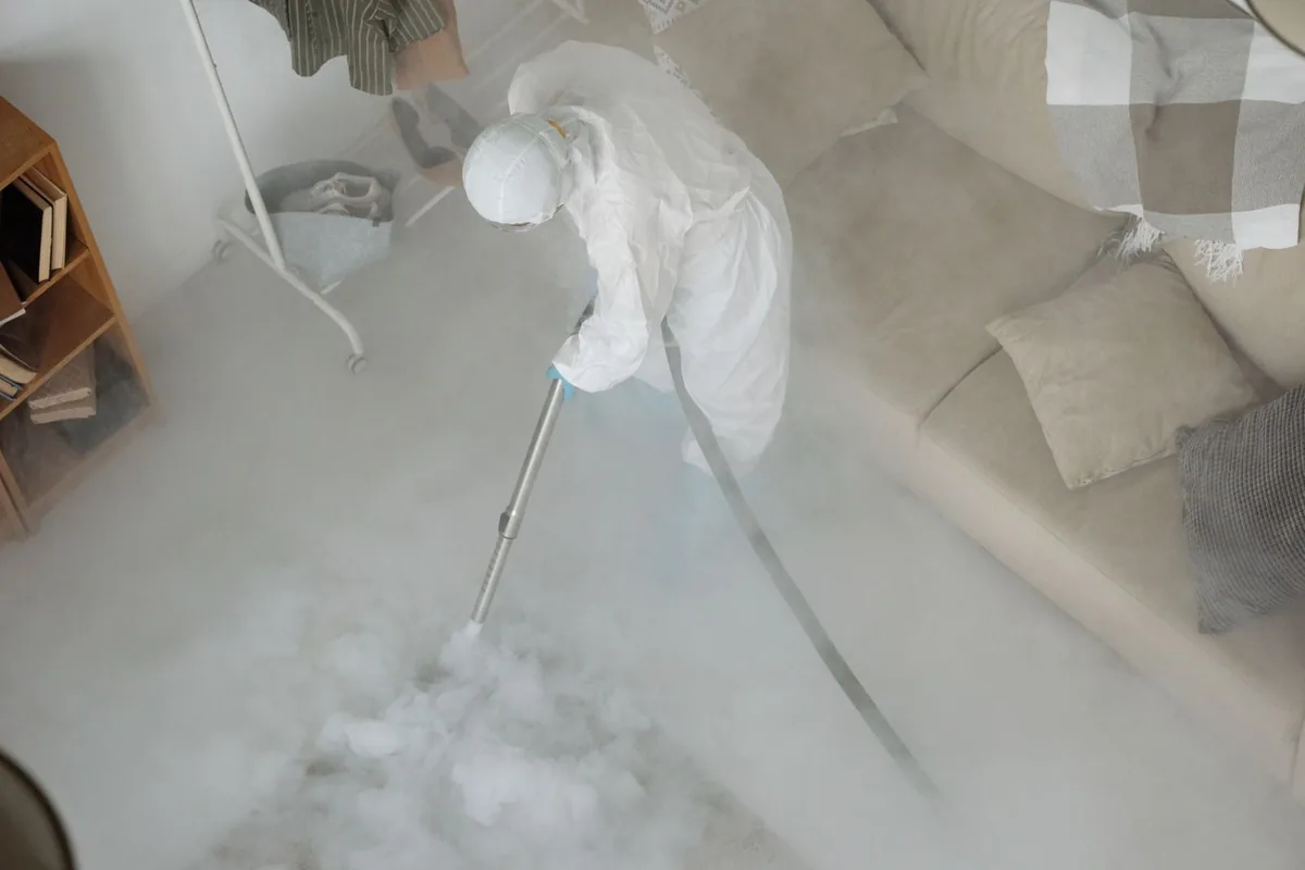 Biohazard cleanup technician in protective equipment, Tornado, WV